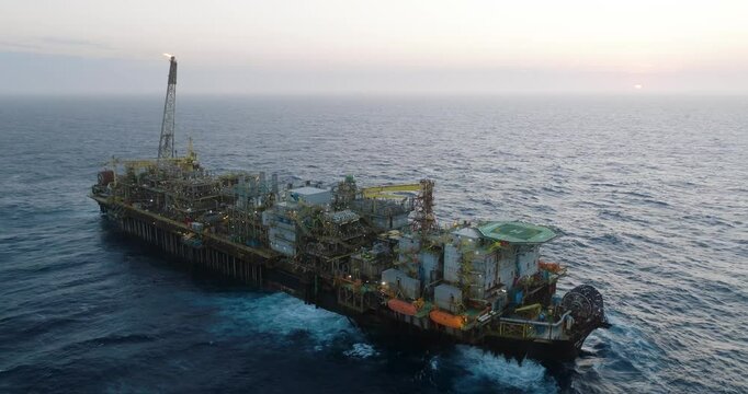 Macao, Brazil - 01 August 2024: Aerial view of the industrial offshore support vessel FPSO FORTE surrounded by ocean waves, Macae, Brazil.