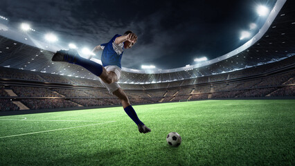 Professional soccer player, forward in yellow and black kit prepares to score, his form silhouetted against golden glow of stadium lights. Concept of sport games, competition, world cup.