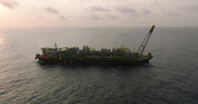 Macao, Brazil - 01 August 2024: Aerial view of the industrial offshore support vessel FPSO FORTE surrounded by ocean waves, Macae, Brazil.