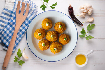 Spanish Tapa croquettes made with bechamel sauce and stuffed fish and mayonnaise. Top view table.