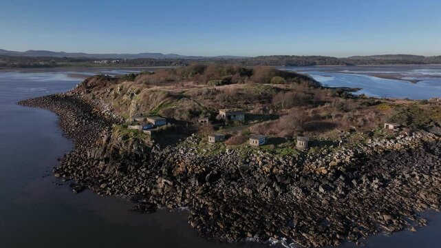 Aerial view of Cramond Island with rocky shorelines and tranquil waters, Cramond, United Kingdom.