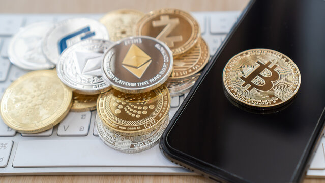 Bangkok, Thailand - 16 April 2021: Crypto currency Bitcoin BTC cryptocurrency blockchain token with altcoin digital asset coin, ETH Ethereum defi p2p decentralized fintech trading cryptography market