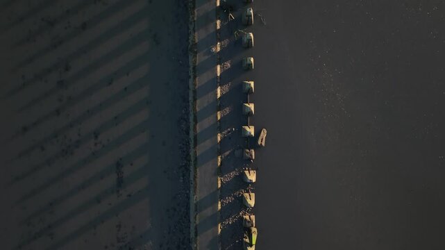 Aerial view of Cramond Island with tranquil waters and beautiful shadows, Edinburgh, United Kingdom.