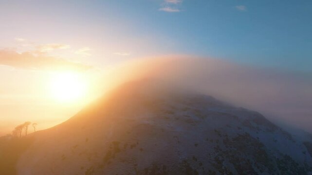 Aerial view of cloud inversion over North Berwick Law at sunset, East Lothian, United Kingdom.