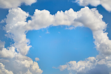 Clouds formed a rectangular frame of clouds, the silhouette of a gate in the sky, heavenly framing with clouds, symbol of the gates in the sky
