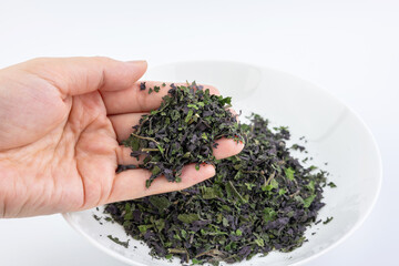 Crushed basil leaves