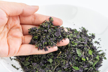 Crushed basil leaves