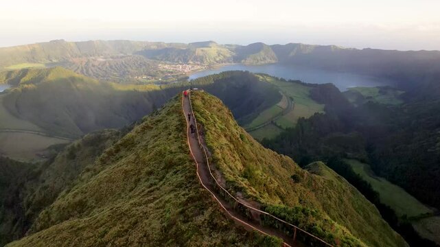 Aerial view of the picturesque Miradouro da Boca Do Inferno overlooking a serene lake and lush valley, Sete Cidades, Sao Miguel, Portugal.
