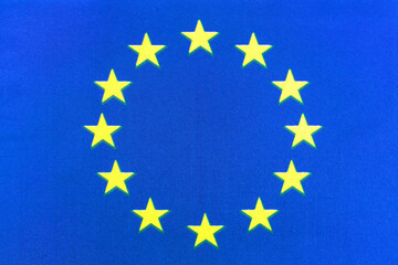 The European Union flag on a fabric basis in close-up