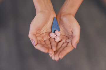 Hands, reproduction and fertility for egg storage on studio background with menstrual cycle or period. Person, infertility and pregnancy in healthcare, ovulation and family planning for ivf treatment