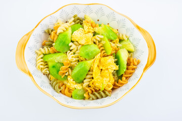 A bowl of fried spaghetti with loofah and eggs