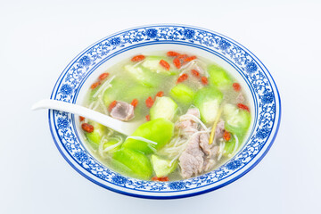 A bowl of loofah, lean meat, enoki mushroom soup