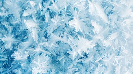 A stunning close-up of frost crystals on a chilled surface reveals delicate ice formations and vibrant blue hues, showcasing natures artistry. Ideal for seasonal themes and tranquil winter visuals.
