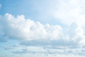Nature view large white clouds with soft sunlight on soft sky background in morning