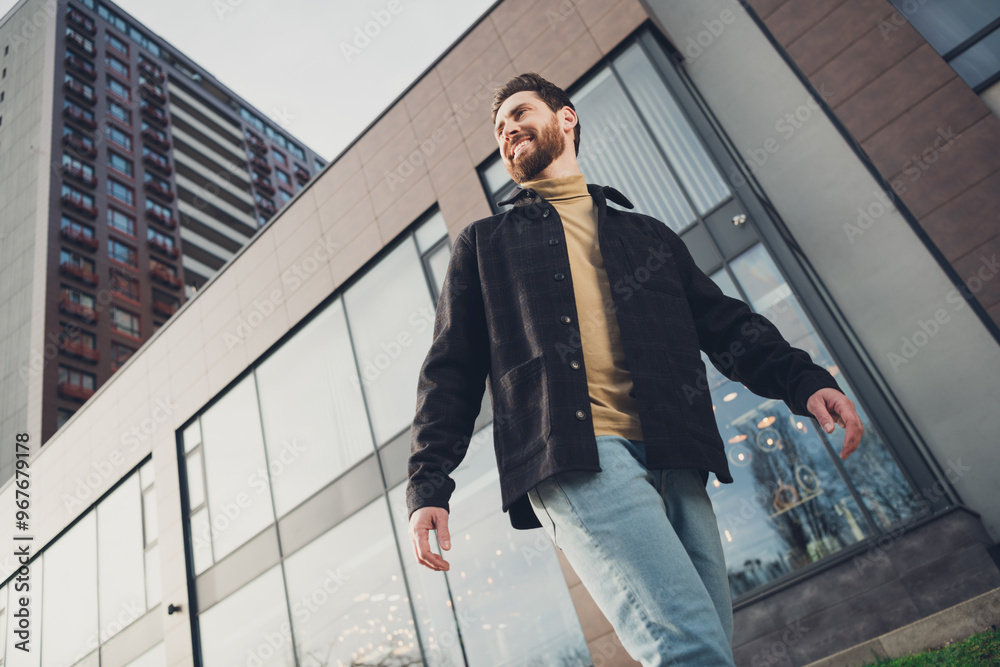 Sticker Photo of cheerful attractive nice man wear stylish clothes walk modern city street autumn day outside