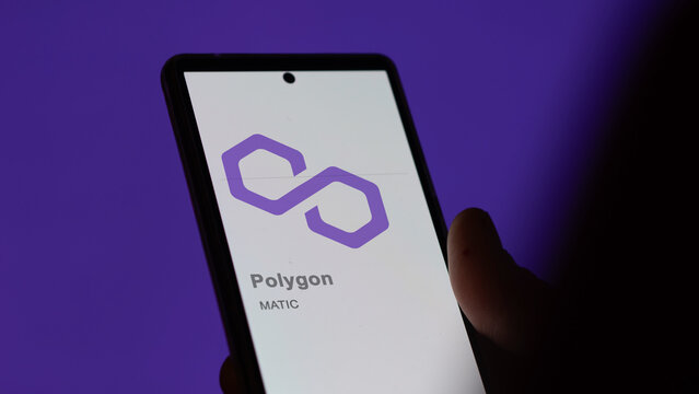 Close up on logo of (MATIC) polygon on the screen of an exchange. (MATIC) polygon price stocks, $MATIC on a device.