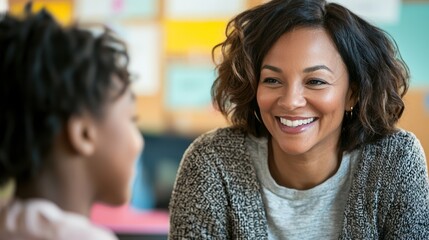 Close-up of a teacher nodding and encouraging a student with a supportive smile