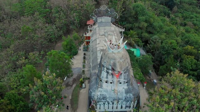 Aerial view of the unique gereja ayam (chicken church) surrounded by lush greenery and trees, Yogyakarta, Indonesia.