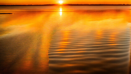 a serene sunset over a calm body of water ,The sun, positioned near the horizon, casts a warm, golden glow across the sky