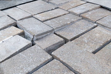 A pile of old concrete slabs. Replacing paving stones.
