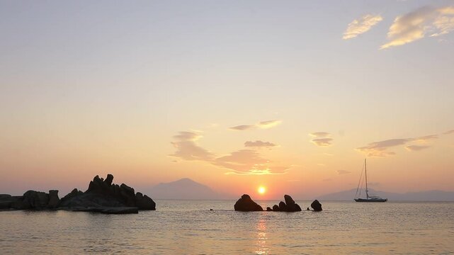 Romantic seascape with sailing yacht at the Mediterranean at sunrise as Blue Cruise  concept.
