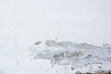 Old white wall with cracks and scratches. Abstract background for design