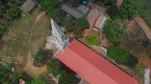 Aerial view of Giao Xu Bach Xa church surrounded by tranquil greenery and rural landscape, Ben Den, Tuyen Quang, Vietnam.