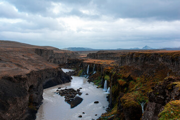 Majestic Canyon River with Waterfalls and Cliffs