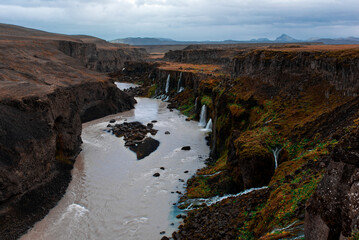 Majestic Canyon River with Waterfalls and Cliffs
