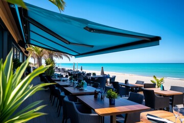 Fototapeta premium A vibrant blue awning at a seaside cafÃ©, shading customers from the sun while offering views of the ocean