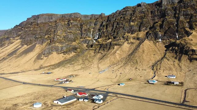 Amazing 4K drone footage of Drangurinn &iacute; Drangshl&iacute;&eth;, Iceland. Explore breathtaking aerial views of this historic rock formation and the nearby traditional Icelandic turf houses