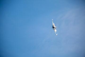 F35 Lightning flying over RAF Lakenheath during sunset creating wingtip vortex's, from a public road