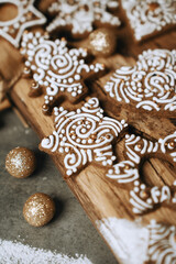 hand-decorated christmas cookies on a wooden background