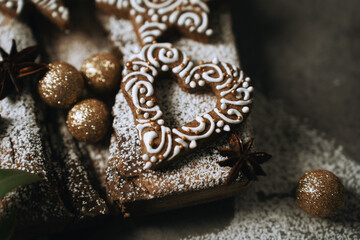 hand-decorated christmas cookies on a wooden background