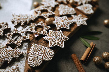 hand-decorated christmas cookies on a wooden background