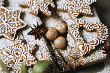 hand-decorated christmas cookies on a wooden background