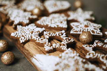 hand-decorated christmas cookies on a wooden background