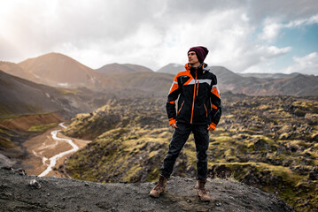 Adventurous Hiker in black Jacket Exploring Mountain Landscape