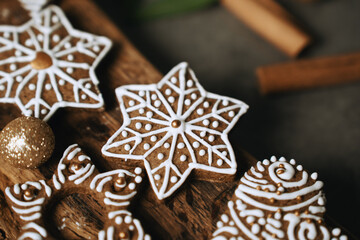 hand-decorated christmas cookies on a wooden background