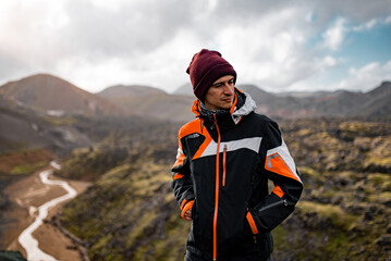 Adventurous Hiker in black Jacket Exploring Mountain Landscape