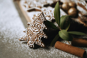 hand-decorated christmas cookies on a wooden background