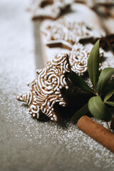 hand-decorated christmas cookies on a wooden background