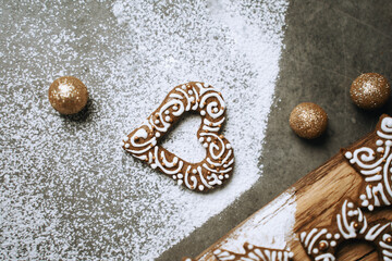 hand-decorated christmas cookies on a wooden background