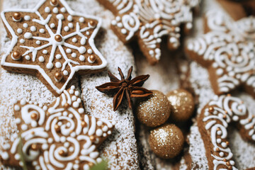 hand-decorated christmas cookies on a wooden background