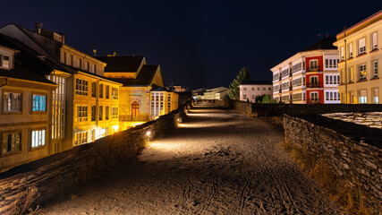 Roman city wall of Then at night that completely surrounds the city, Galicia.