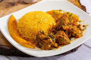 A mouthwatering dish of Seco de chivo chancho featuring a rich and savory sauce, served with tender chunks of goat, pork, and beef. Accompanied by a generous portion of moros de lenteja (lentil rice)