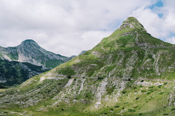 Panoramic Mountain Range and Views - Alpine style Alps in Durmitor, Montenegro - Wide Landscape Shot of epic Mountains and Roads