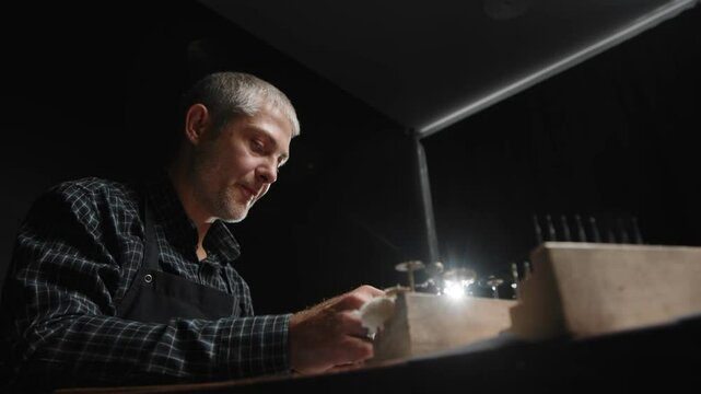 A man creates a piece of jewelry.