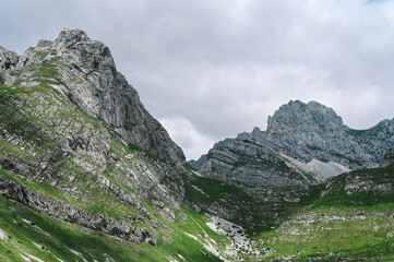 Panoramic Mountain Range and Views - Alpine style Alps in Durmitor, Montenegro - Wide Landscape Shot of epic Mountains and Roads