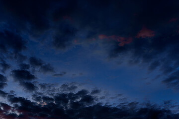 Moody twilight sky with dark storm clouds and fading light in color 2025 future dusk, pantone. nature pattern © Tatiana